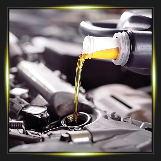 Motor oil pouring to car engine.